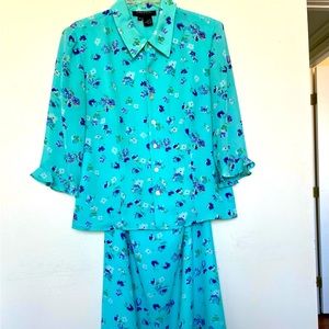 Two pieces outfit, long pants and blouse.